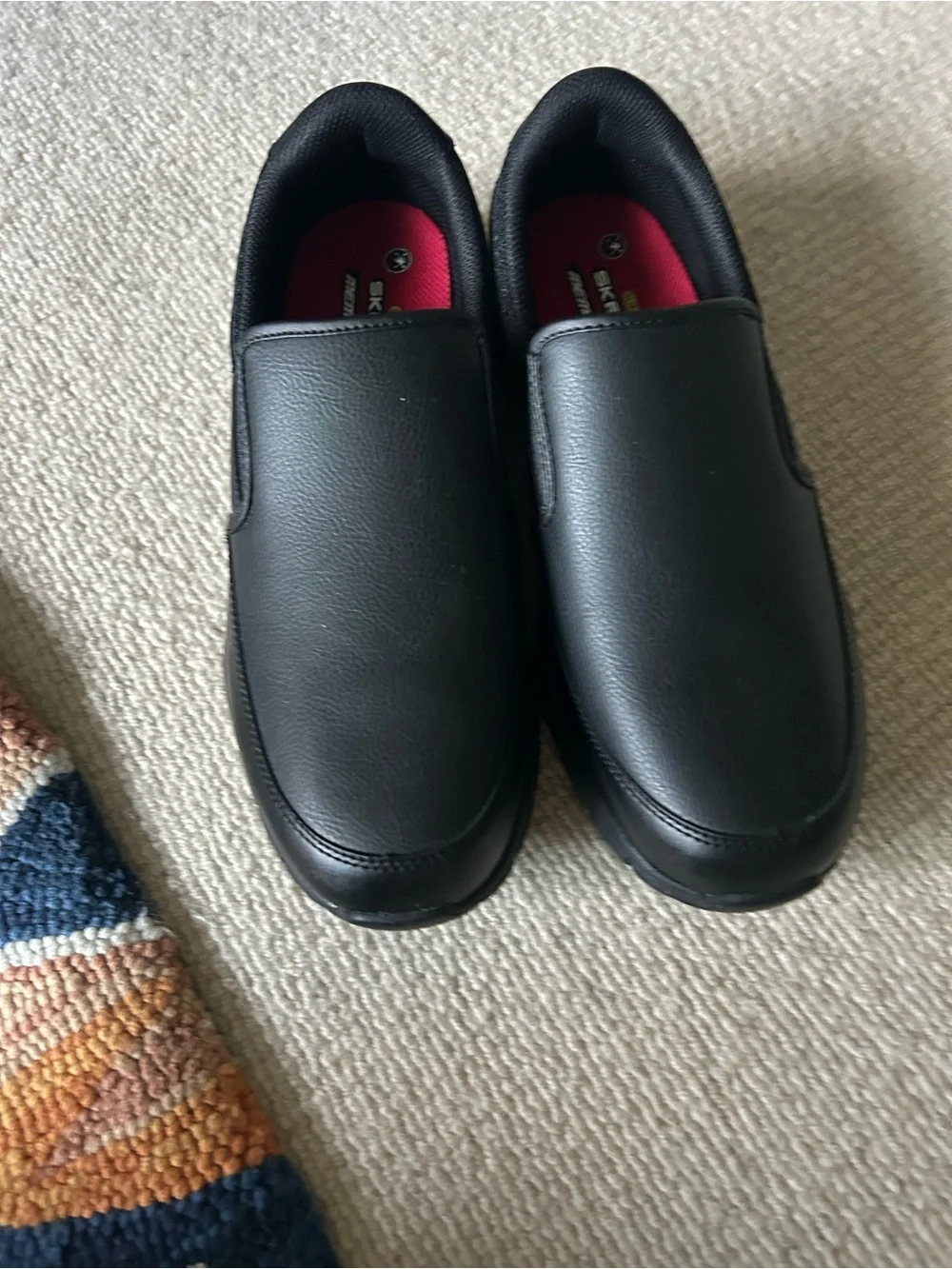 Skechers Black Slip-On Comfort Loafers with Red Insole